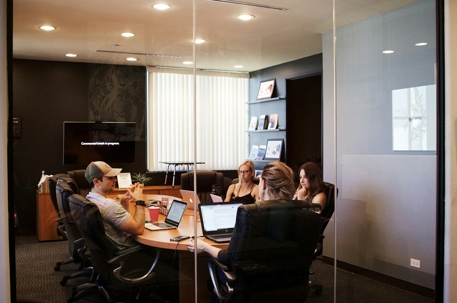 Colleagues working through a project in a meeting room