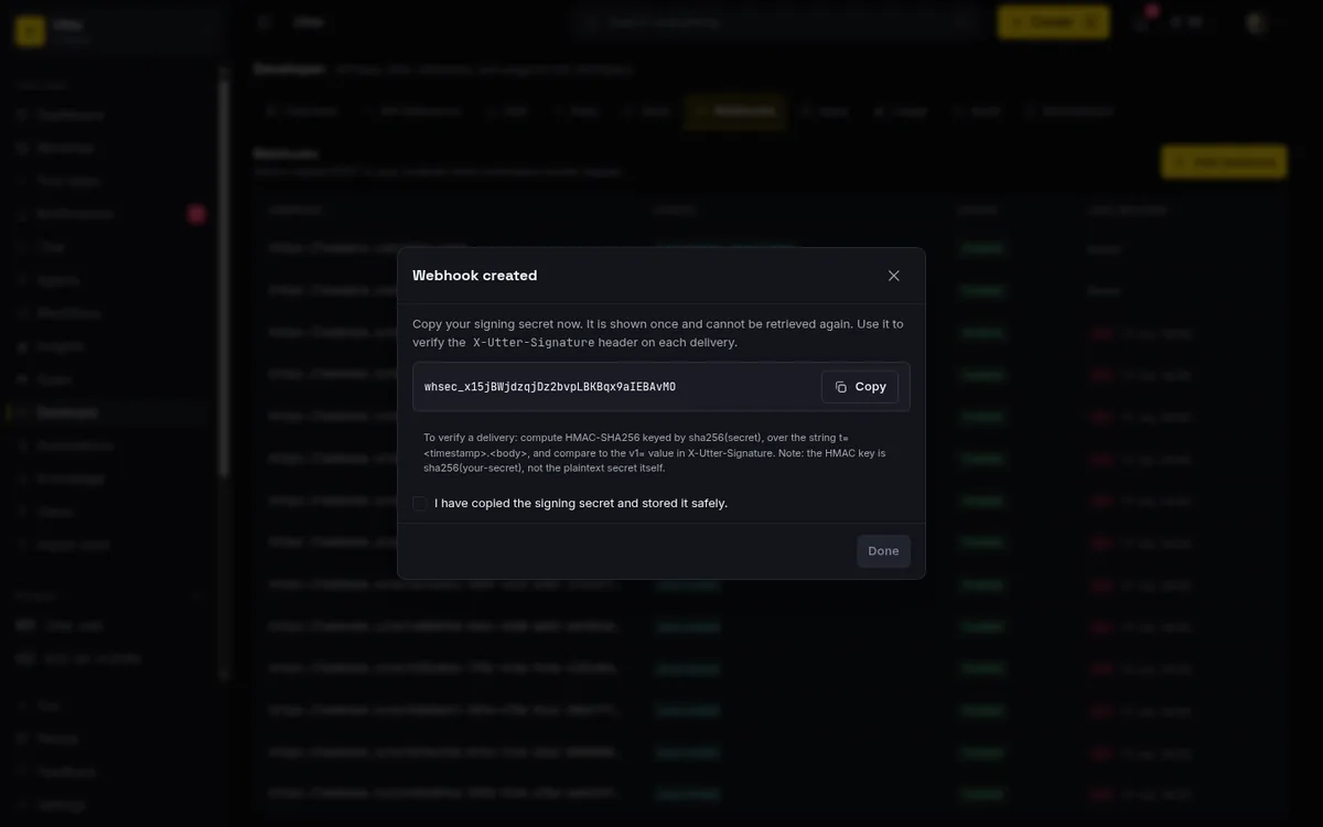 The one-time Webhook created dialog showing the whsec signing secret, the copy button, and the mandatory confirmation that you saved it
